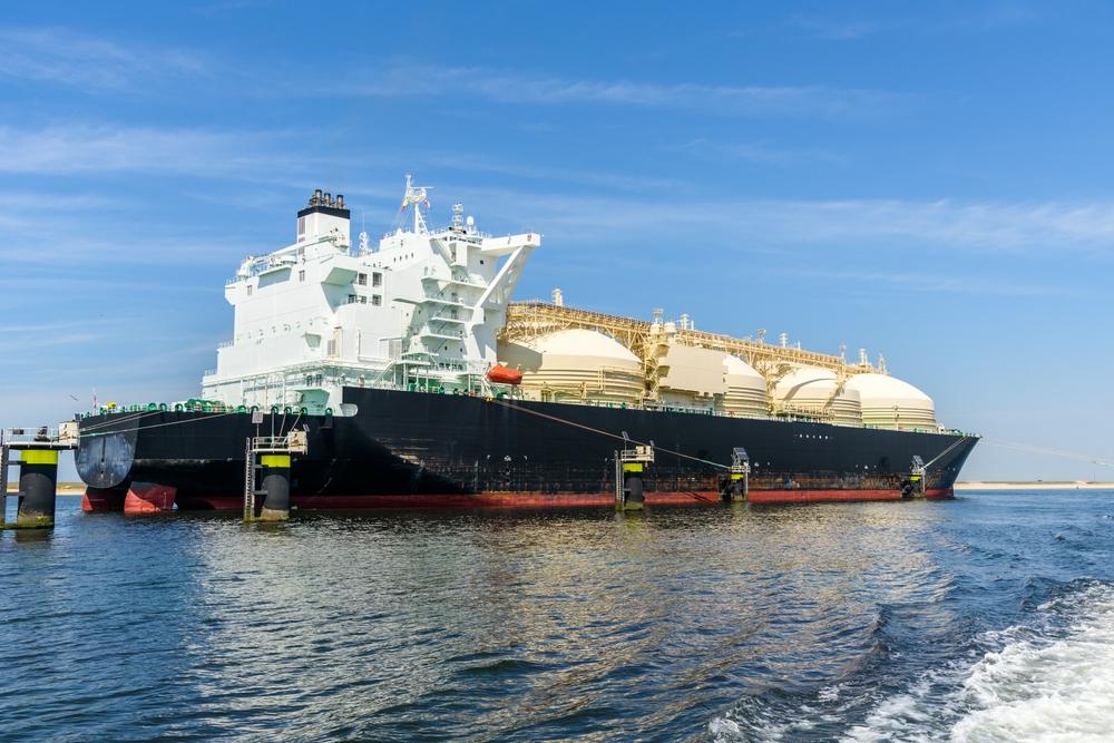 Picture of a black LNG tanker ship in water